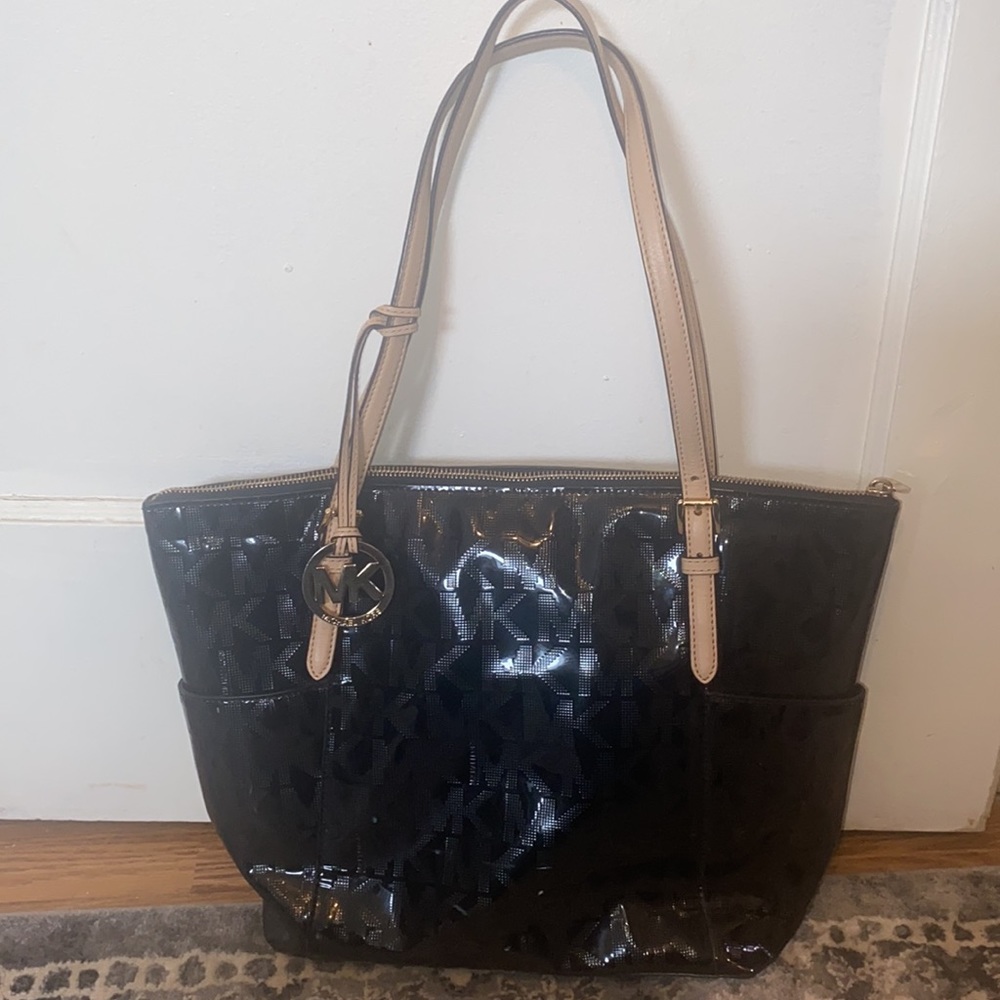 Michael Kors Jet Set patent leather handbag with zipper closure